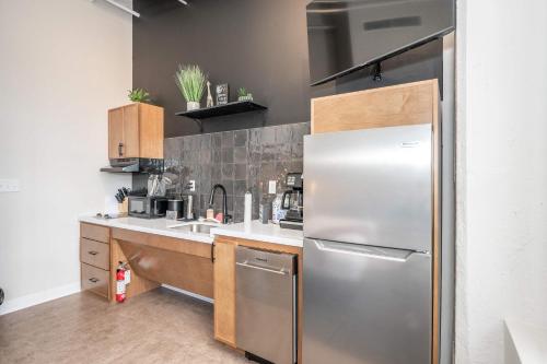 a kitchen with a stainless steel refrigerator at The 333 Suites 204 - Stay for 2 in Cincinnati