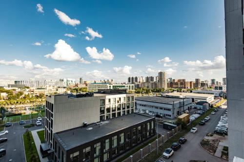 an aerial view of a city with buildings and cars at New апартаменты возле Материнства и Детства in Taldykolʼ