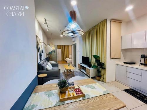 a living room with a kitchen and a living room at ITCC Manhattan Suites By Coastal Charm in Penampang