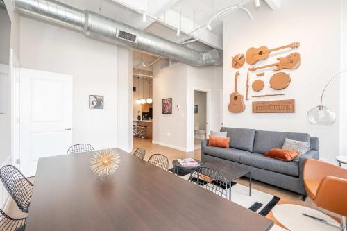 a living room with a table and a couch at The 333 Suites 303 - Suite for 6 in Cincinnati
