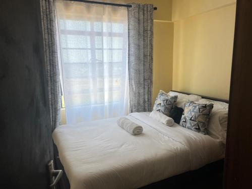 Una cama o camas en una habitación de The R&M Escapes