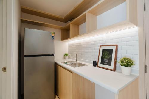 Kuchyň nebo kuchyňský kout v ubytování I-Zen Residence Central Eastville