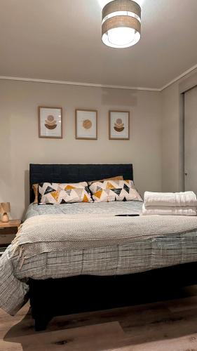 a bedroom with a large bed with pillows on it at Vistas de Valparaíso 617 in Valparaíso