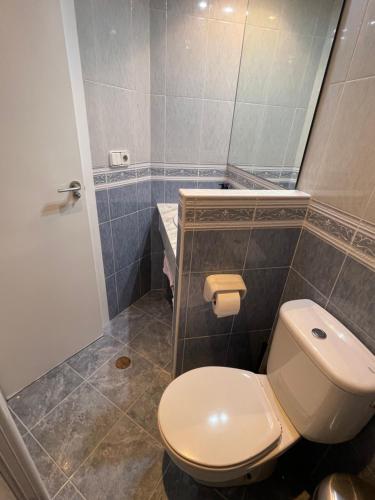 a bathroom with a white toilet and a shower at &luxe vista mar& in Calpe
