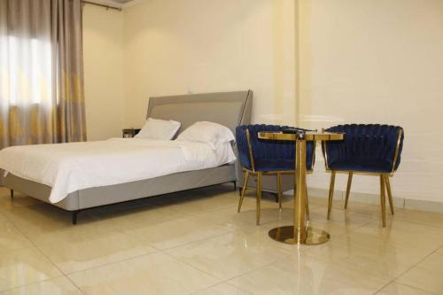 Ένα ή περισσότερα κρεβάτια σε δωμάτιο στο Bel'hotel bangui