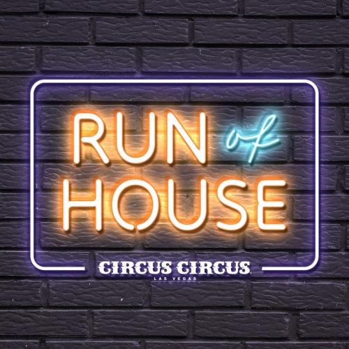 a neon sign that reads run of house on a brick wall at Circus Circus Hotel, Casino & Theme Park in Las Vegas