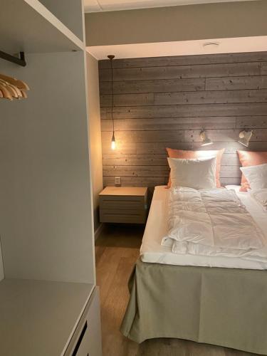 En eller flere senge i et værelse på Ruka Village, 4BR Suite A27, 133m2