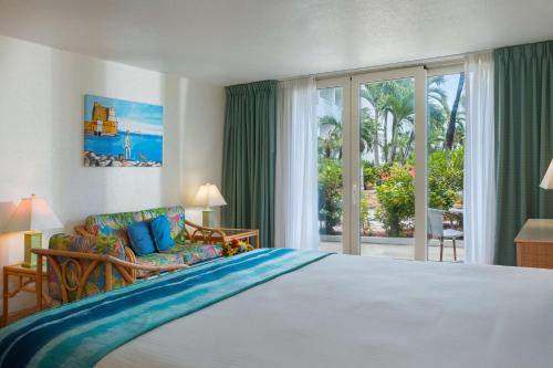 Postel nebo postele na pokoji v ubytování Royal Islander Club Resort La Plage