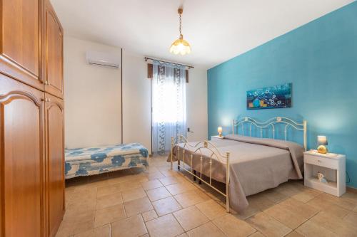 Postel nebo postele na pokoji v ubytování Villa Girasole