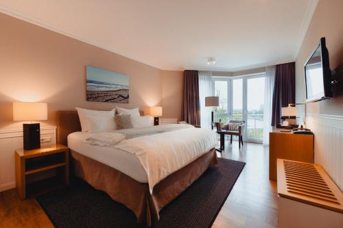 Giường trong phòng chung tại ConventGarten Hotel & Restaurant - am Nord-Ostsee-Kanal