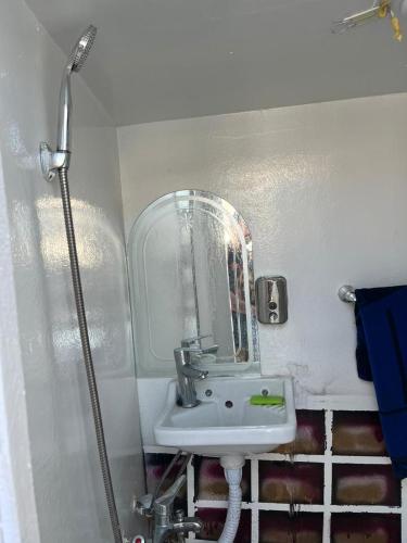a bathroom with a sink and a shower at Felucca, welcome sailing in Aswan