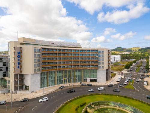 an office building with a road in front of it at VIP Executive Azores Hotel in Ponta Delgada