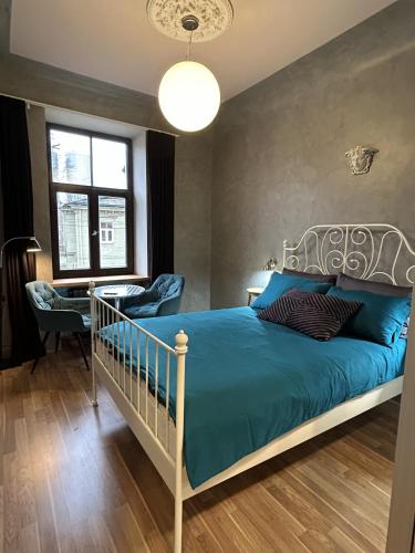 Postel nebo postele na pokoji v ubytování RedDoor Apartaments