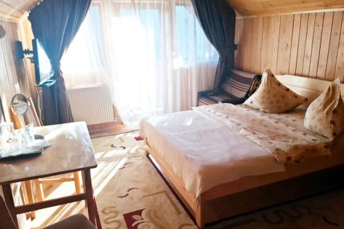 Postel nebo postele na pokoji v ubytování Pensiunea ALEROX