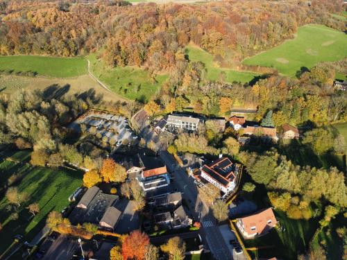 an aerial view of a house in a forest at Hof van Slenaken - Hotel & Apartments in Slenaken