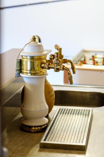 a mixer sitting on a counter next to a sink at Chalupa Brumov in Brumov