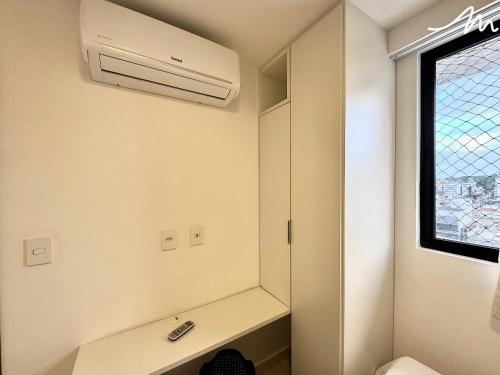 a bathroom with a air conditioner on the wall at Apartamento com Vista p/o Mar-Cabo Branco in João Pessoa