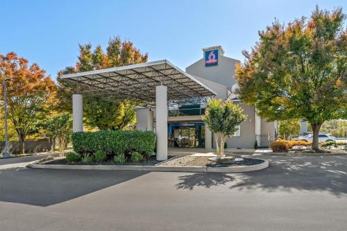 a building with a parking lot in front of it at Studio 6 King of Prussia PA Philadelphia in King of Prussia