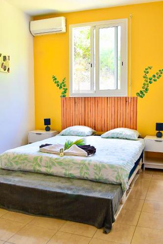 Ένα ή περισσότερα κρεβάτια σε δωμάτιο στο La Villa du Sommet