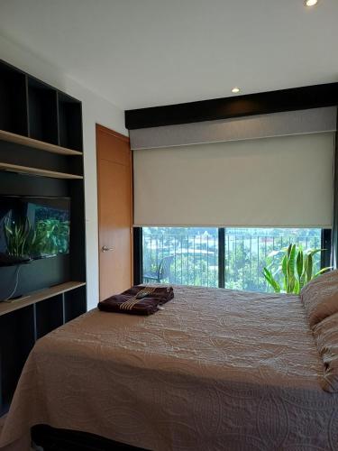 Ένα ή περισσότερα κρεβάτια σε δωμάτιο στο Apartamento en Kanajuyu