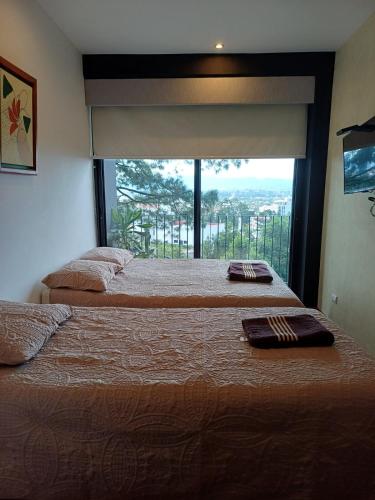 Ένα ή περισσότερα κρεβάτια σε δωμάτιο στο Apartamento en Kanajuyu