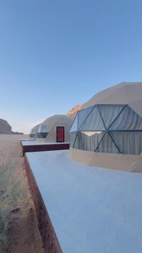 two domes in the middle of the desert at Rehana rum luxury camp in Wadi Rum