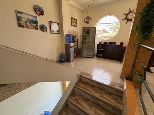 a view of a kitchen with stairs in a house at Hostal Shaddai in Manta