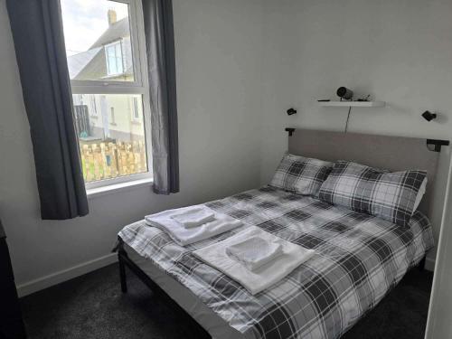 Ένα ή περισσότερα κρεβάτια σε δωμάτιο στο Apartment - Sleeps 4 - Hot Tub Pet-Friendly