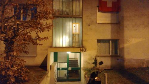 a motorcycle parked in front of a building at Bern str 140 in Ostermundigen