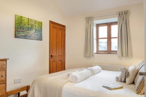 a bedroom with a bed with towels on it at 3 Bed in Whitwell oc-h33498 in Whitwell