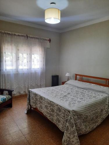 Ένα ή περισσότερα κρεβάτια σε δωμάτιο στο Cabañas Roma