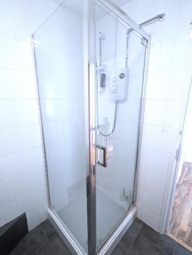 a shower with a glass door in a bathroom at The Music Rooms! Rooms above Griffin Pub-Winter 2026 Sale! in Southampton