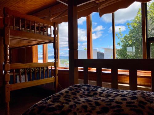 Ένα ή περισσότερα κρεβάτια σε δωμάτιο στο Hostel Patagonia Backpackers