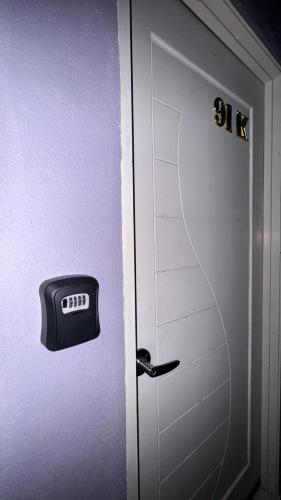 a door with a mailbox on the side of it at AL Homestay Pendang in Pendang