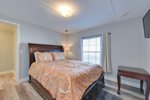 a bedroom with a bed and a window and a desk at Heart of Greensboro Pet-Friendly Gem 3 Mi to Dtwn in Fisher Park