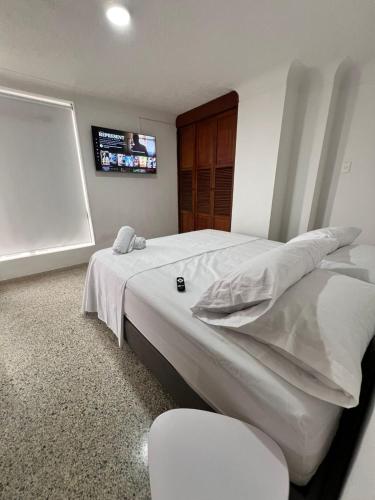 Postel nebo postele na pokoji v ubytování Tu Hogar en Bucaramanga - Apartamento de 135 m2 con Parqueadero y Excelente Ubicación