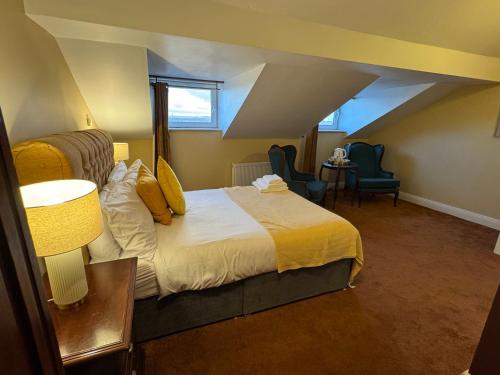 a hotel room with a bed and a window at The Sardinian Guesthouse (6 Bedrooms) in Cobh