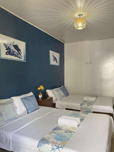 Ένα ή περισσότερα κρεβάτια σε δωμάτιο στο Blue Water De Santorini