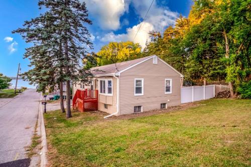 a small house on the side of a street at The Main Stay - Mineola Bay Lakeview and Access - Fully Furnished Monthly & Seasonal Rental in Fox Lake in Fox Lake