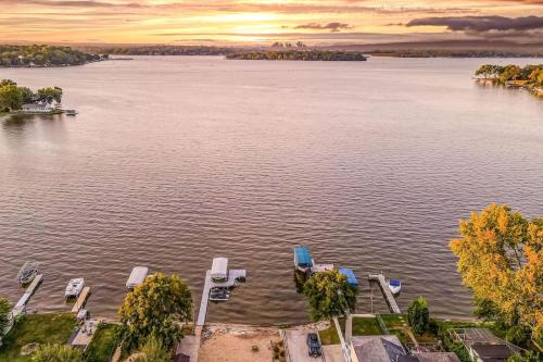 an aerial view of a lake with chairs and a dock at The Main Stay - Mineola Bay Lakeview and Access - Fully Furnished Monthly & Seasonal Rental in Fox Lake in Fox Lake