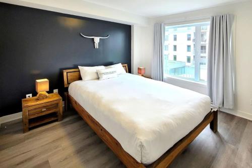 En eller flere senge i et værelse på Corporate Stays Blum 1 Bedroom