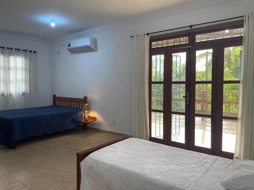 Postel nebo postele na pokoji v ubytování Casa da Nadir Spalla - Praia de Cumuruxatiba