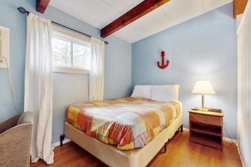 Ένα ή περισσότερα κρεβάτια σε δωμάτιο στο Sandy Toes Escape - Holiday House M6