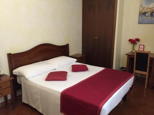 Postel nebo postele na pokoji v ubytování Hotel Bologna