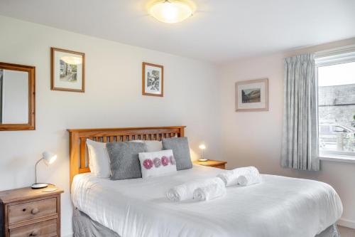 a bedroom with a large white bed with two pillows at 2 Bed in Whitwell oc-o33499 in Whitwell