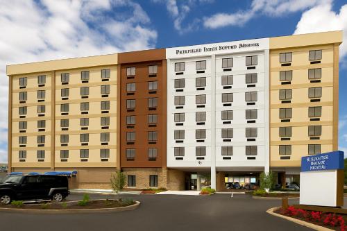 a building with a truck parked in front of it at Fairfield Inn & Suites by Marriott Alexandria West/Mark Center in Alexandria