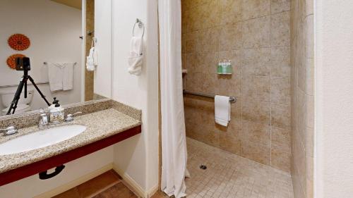 a bathroom with a sink and a shower at LV026 Secluded Downstairs Legacy Villas Studio in La Quinta
