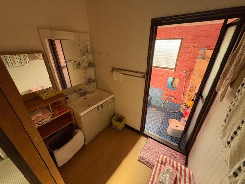 a small bathroom with a shower and a sink at Kohaku - Vacation STAY 20499 in Nagahama