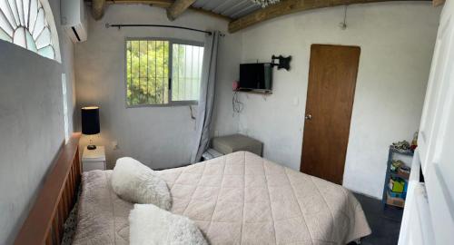 Ένα ή περισσότερα κρεβάτια σε δωμάτιο στο Casa en punta N a 12 minutos de Piriapolis
