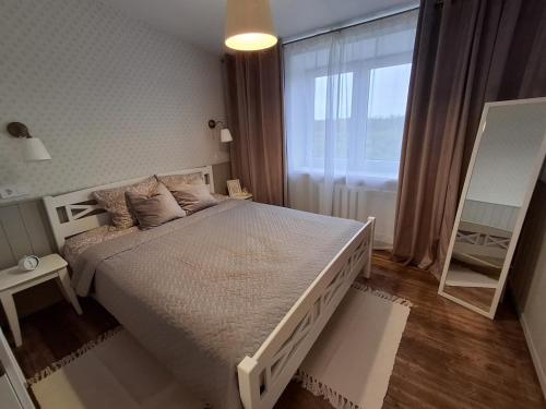 Postel nebo postele na pokoji v ubytování Tammiku apartment